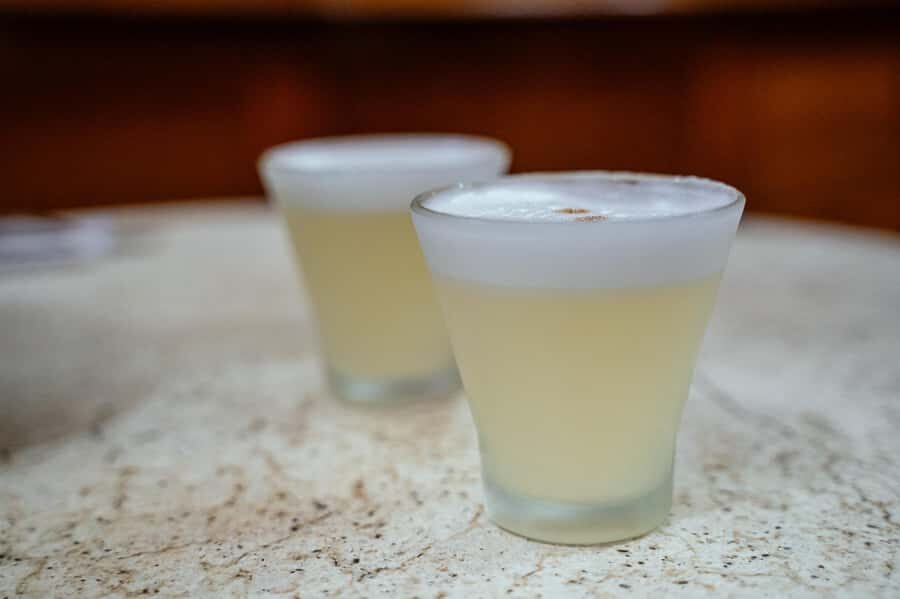 Lima: Flavors and Tradition Walking Tour with Food Tasting - Cordano Tavern and pisco sour: a 100+ year finish near the Government Palace area