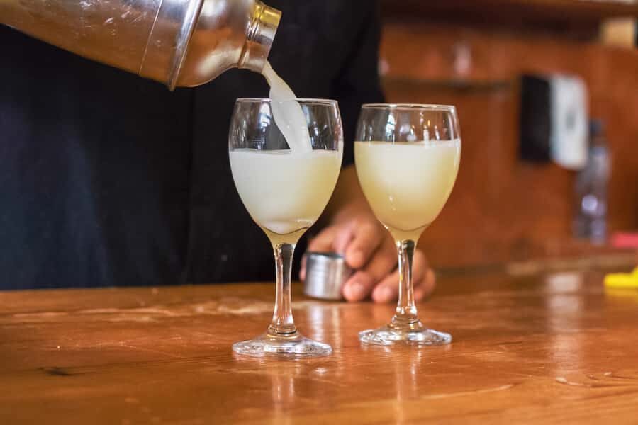 Lima: Lights, Pisco, and Fun Night Tour and Pisco Tasting - Traditional bars and a street-food stop: keeping the evening local